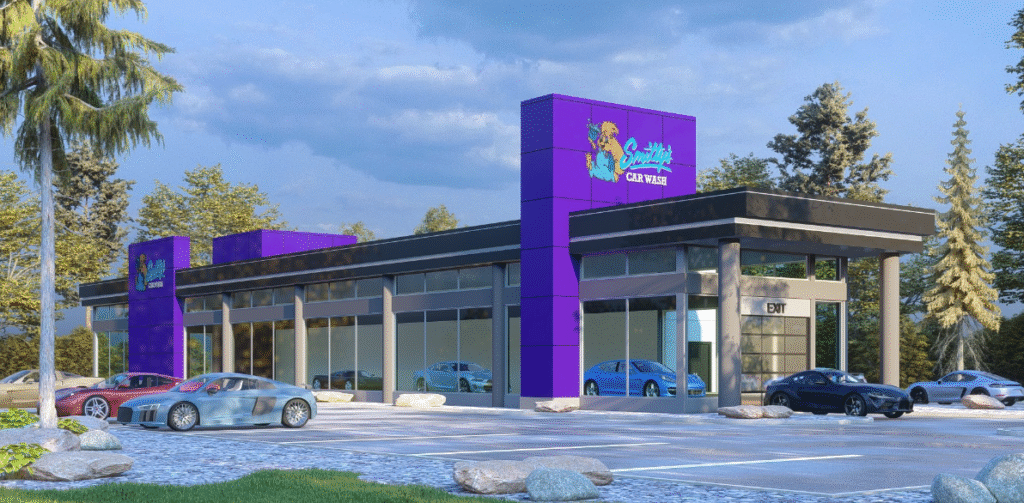 A visual representation of a new car dealership with a stylish exterior and numerous cars parked in the lot.